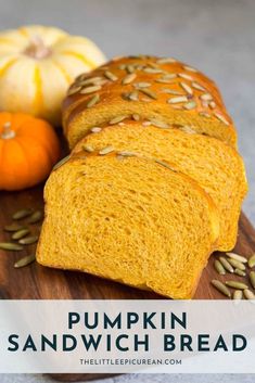 pumpkin sandwich bread with seeds on a cutting board