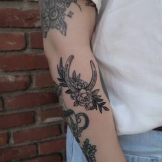 a person with a tattoo on their arm