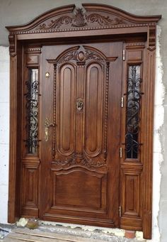 a wooden door with ornate carvings on it