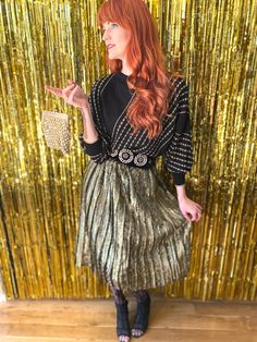 "Vintage 80s gold metallic and black elastic waist 80s pleated skirt. Made in France and such a fun piece. Perfect for going out, work or even a more formal event! Shown here adjusted on a size FR 34 /UK 6 / US 0 / XS model of 172cm / 5'8\" height. This would best fit a size XS-M due to it's elastic waist depending on your desired fit, but please verify all measurements to be sure. Waist:  30cm / 12in and stretches to 46cm / 18in Hips: 58.5cm - 23in (a bit more due to pleating) Total length from Gold Metallic Skirt, Metallic Skirt, First Look, Formal Event, Vintage Gold, Pleated Skirt, Made In France, Gold Metal, Elastic Waist