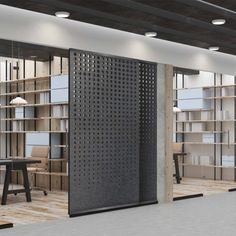 an office with open bookcases and tables