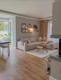 a living room filled with furniture and a fire place in front of a sliding glass door