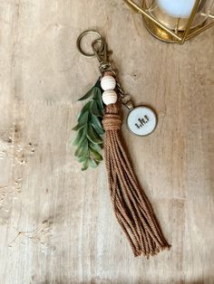 a keychain with a tassel hanging from it's side on a table