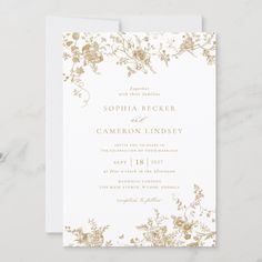 a wedding card with gold foil flowers on it