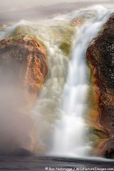 the water is rushing over the rocks and into the river to see what looks like it's coming out