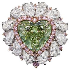 From The Museum Vault at Emilio Jewelry Located on New York's iconic Fifth Avenue, Showcasing a very special and rare Gia certified natural fancy intense Green heart shape over 6.00 astonishing carats set in the center. We specialize in creating special mountings for green diamonds that will increase the color and bring it out the maximum potential of the center, and therefore now it has a visual of fancy vivid green! Please inquire for center details. Hand made in the Emilio Jewelry Atelier, wh Emilio Jewelry, Jewelry Atelier, Green Diamond Ring, Female Rings, Heart Shaped Diamond Ring, Green Diamond Rings, Colored Diamond Jewelry, Green Diamonds, Diamond Rings With Price