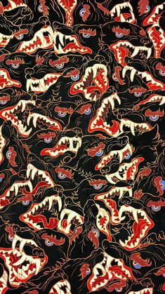 an image of a black background with red, white and blue designs on the fabric