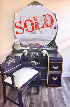 an antique vanity with a sale sign on it and a chair in front of it