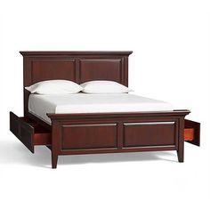 a bed with two drawers underneath it and a white sheet on the bottom half of the bed