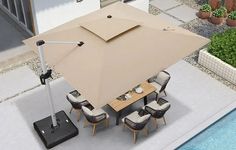 an overhead view of a patio table and chairs with an umbrella over the dining area