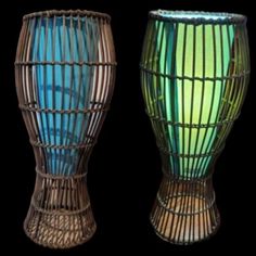 two vases with different designs on them, one is blue and the other is green