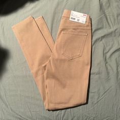 Tan Colored, New With Tags Khaki Stretch Mid-rise Bottoms, High Rise Slim Fit Pants With Pockets, Trendy Tight Straight Leg Pants, Beige Stretch High Rise Jeans, Khaki High Rise Stretch Pants, High Rise Stretch Khaki Pants, Beige Stretch Straight Leg Pants, Khaki High Waist Stretch Jeans, Stretch Beige Straight Leg Pants