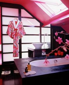 a bath room with a tub a sink and a window on the wall in it