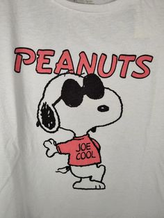 a peanuts t - shirt with the word peanuts on it and a cartoon character wearing sunglasses