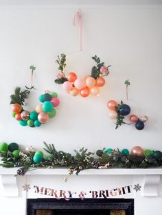 a fireplace decorated with balloons and garlands