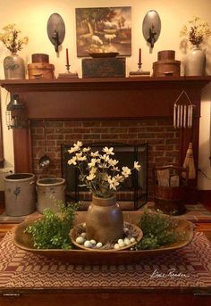 the fireplace is decorated with flowers and eggs