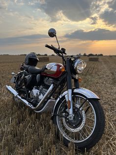 a motorcycle parked in the middle of a field