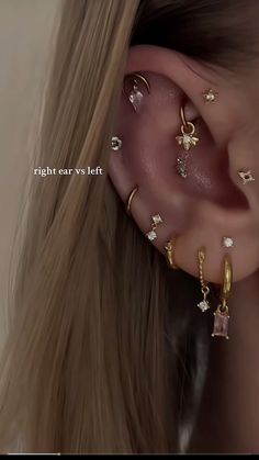 a woman wearing ear piercings with stars on them