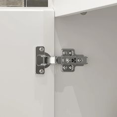 an open door with two metal latches on it