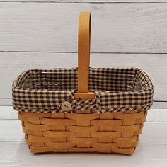 an empty basket sitting on top of a white table