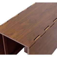 a close up of a wooden table with holes in the top and bottom section, on a white background