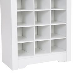 a white bookcase with lots of shelves on it