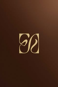 the letter s is inscribed in gold on a brown background