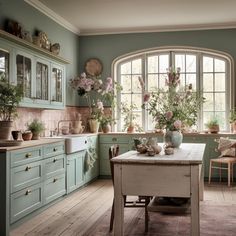 a kitchen filled with lots of potted plants next to a table and chairs in front of a window