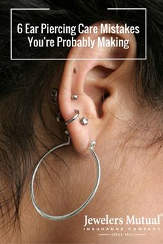 an ear piercing is shown with the words, 6 ear piercing care mistakes you're probably making