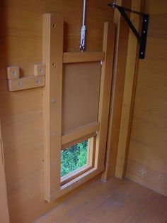 the inside of a horse trailer with its door open and window closed to let in light