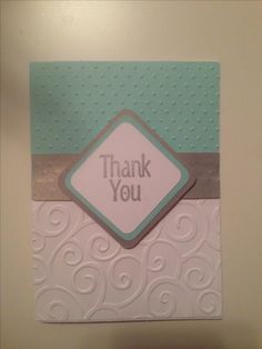 a thank you card is hanging on the wall