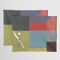 three napkins with forks and knives on them in different color blocks, one is green, the other is red