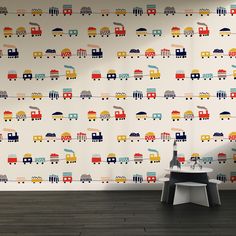 a child's room wallpaper with trains and cars on it, along with a stool