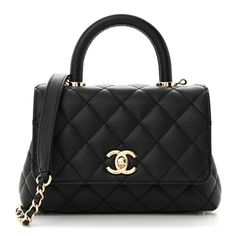 This is an authentic CHANEL Caviar Quilted Extra Mini Coco Handle Flap in Black. This stylish and classic tote is crafted of diamond-stitched grained caviar leather in black. The shoulder bag features a rear patch pocket, rolled leather top handle, a leather-threaded gold chain-link shoulder strap, and a gold CC turn-lock closure. The flap opens to a partitioned burgundy leather interior with a zipper and pocket. Chanel Coco Handle, Coco Handle, Chanel Mini, Chanel Caviar, Bag Handle, Leather Interior, Leather Top, Chanel Bag, Chain Link