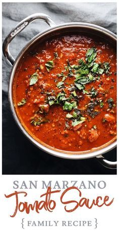 a pan filled with tomato sauce on top of a table