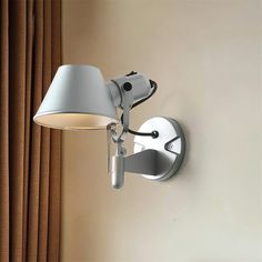 a lamp mounted on the side of a wall