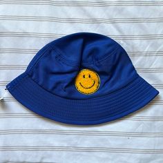 New With Tags. Bucket Hat With Smiley Face Patch, Royal Blue 90s Style Bucket Hats, Smiley Face Bucket Hat, Cute Yellow Smile Face Bucket Hats Details: * One Size Fits Most * Breathable * Hat Materials: Cotton And Polyester * Smiley Face Patch: High Quality Towel Cloth Material, 2.36 In Measurements (Inches) S/M: * Hat Circumference: 22 * Crown Height: 3.5 * Top Diameter: 6 Style Bucket Hat, Y2k Girls, Yellow Smiley Face, Face Patches, Retro Ski, Navy Hats, Dinosaur Kids, Pink Hat, Blue Hat