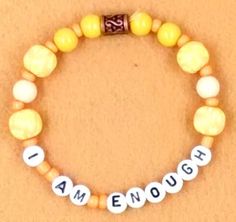 I Am Enough Affirmation Bracelet.  The peach colored ceramic beads are surrounded by I Am Enough lettering.   This bracelet will easily stretch. Make your selection using size chart.   Be sure to measure your wrist in inches to determine the size that is comfortable for you, including the ability to slip it over your hand Feminist Bracelet, Enough Affirmation, Affirmation Bracelets, Harrisburg Pa, I Am Enough, Bracelet Friendship, Friendship Gifts, Plastic Beads, Ceramic Beads