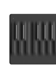 a black and white photo of an electronic device that is designed to look like piano keys