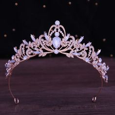 a tiara is shown on a wooden table