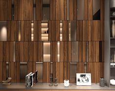 a kitchen with wooden cabinets and shelves on the wall