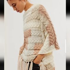 Nwt Free People Revelry Cable Fringe Poncho Oversized White Poncho For Fall, Cozy White Cape For Fall, White Bohemian Poncho For Winter, Cozy White Poncho For Fall, Cozy Oversized White Poncho, Bohemian White Poncho Cape, Cream Bohemian Long Sleeve Poncho, Oversized White Poncho Cape, Oversized White Cape Poncho