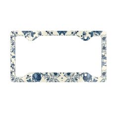 a blue and white flowered license plate frame with an oval hole in the middle