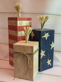 two wooden blocks decorated with american flags and corn stalks