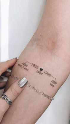 a woman's arm with a tattoo on it that reads, i love you