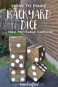 four wooden dices stacked on top of each other with the words how to make diy yard dice