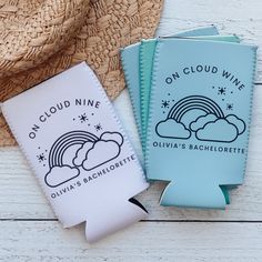 two blue and white paper bags with the words on cloud nine