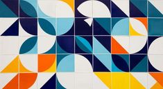 an artistic tile design in blue, yellow and orange colors with overlapping shapes on it