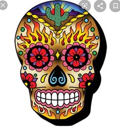 a colorful skull with flames and flowers on it's face, in the shape of a