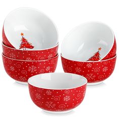 three red and white bowls with christmas tree designs on the bottom, one bowl is empty